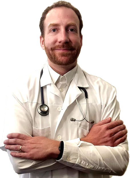 Docteur Thomas Breuneval souriant en blouse blanche et stéthoscope.